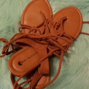 Brown sandles that wrap around your leg